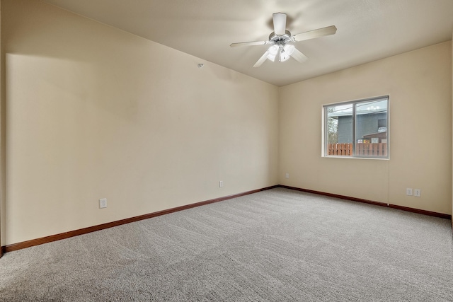 1632 Evergreen Dr, Rapid City, SD 57702 - unfurnished room with baseboards, carpet floors, and ceiling fan