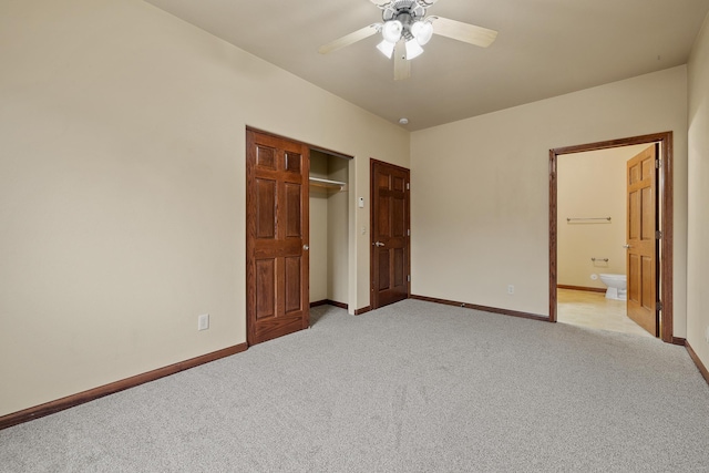 1632 Evergreen Dr, Rapid City, SD 57702 - unfurnished bedroom with light carpet, baseboards, connected bathroom, and a closet