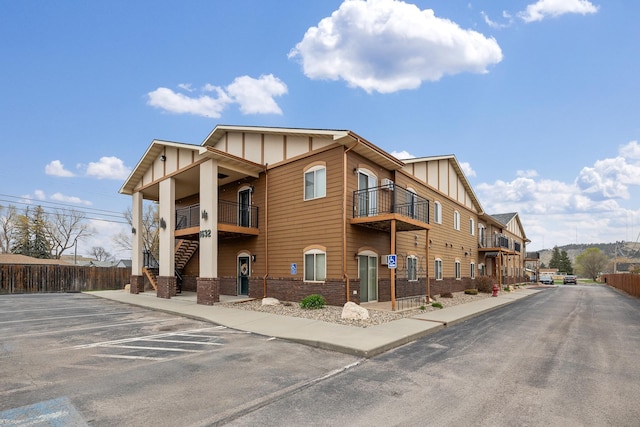 1632 Evergreen Dr, Rapid City, SD 57702 - view of building exterior with fence and uncovered parking