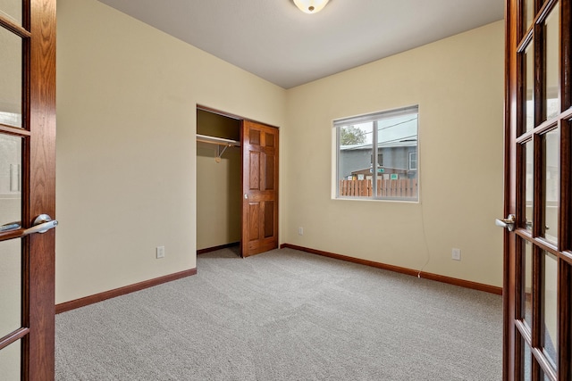 1632 Evergreen Dr, Rapid City, SD 57702 - unfurnished bedroom with a closet, carpet flooring, and baseboards