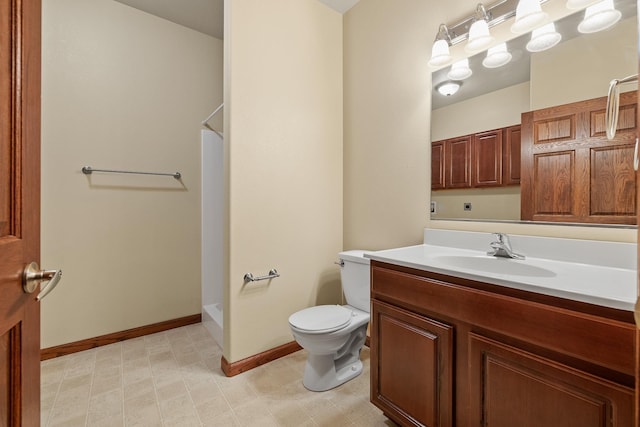 1632 Evergreen Dr, Rapid City, SD 57702 - full bath with tile patterned floors, vanity, a shower, baseboards, and toilet