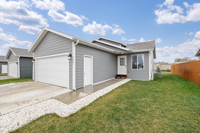2207 Other, Rapid City, SD 57703 - ranch-style house with concrete driveway, a front lawn, an attached garage, fence, and entry steps