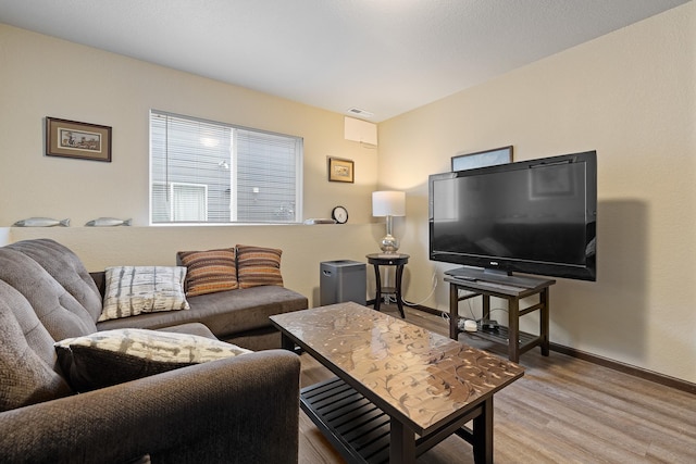 2207 Other, Rapid City, SD 57703 - living area with baseboards, wood finished floors, and visible vents