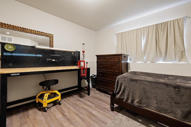 2207 Other, Rapid City, SD 57703 - bedroom featuring wood finished floors and visible vents