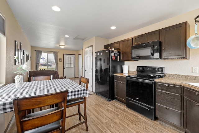 2207 Other, Rapid City, SD 57703 - kitchen featuring light wood-type flooring, dark brown cabinetry, recessed lighting, light countertops, and black appliances
