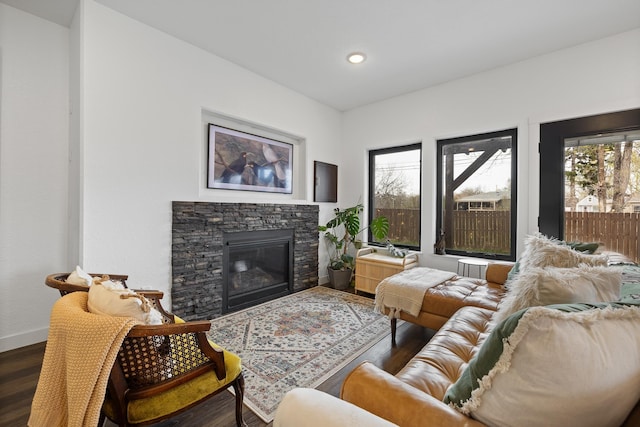 3818 W Main St, Rapid City, SD 57702 - living room with a stone fireplace, baseboards, dark wood-type flooring, and recessed lighting