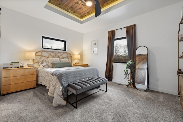 3818 W Main St, Rapid City, SD 57702 - carpeted bedroom with wooden ceiling, baseboards, and a raised ceiling