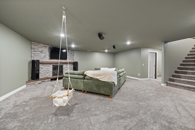 3818 W Main St, Rapid City, SD 57702 - carpeted living area featuring a fireplace, baseboards, stairs, and recessed lighting