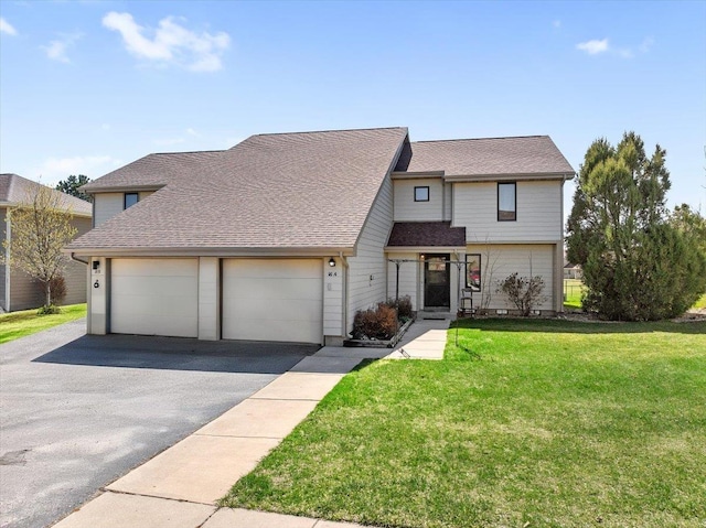 16A Statesboro Dr, Belle Fourche, SD 57717 - townhome / multi-family property with asphalt driveway, a front yard, an attached garage, and roof with shingles