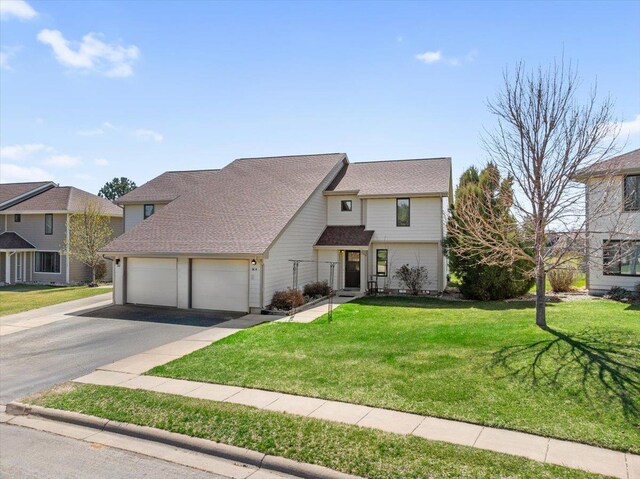 16A Statesboro Dr, Belle Fourche, SD 57717 - view of front of property with driveway, an attached garage, and a front lawn