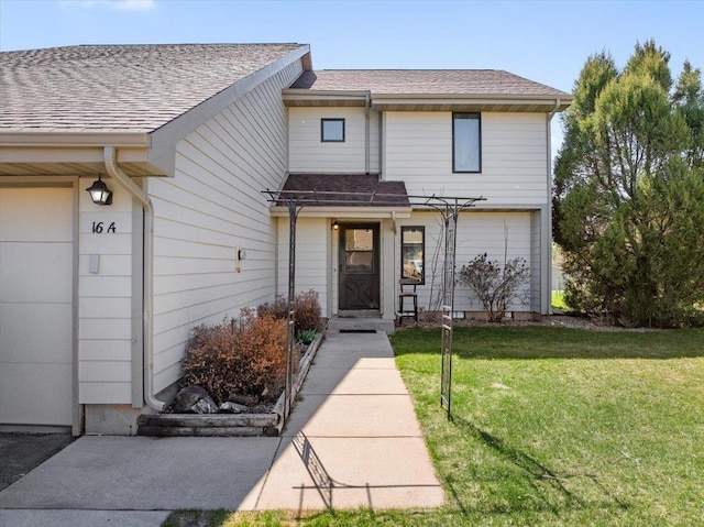 16A Statesboro Dr, Belle Fourche, SD 57717 - view of front of property with a front yard and roof with shingles