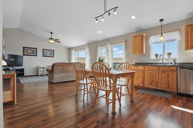 dining space featuring vaulted ceiling, dark wood-style floors, and ceiling fan