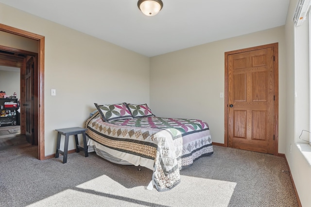 bedroom featuring carpet floors and baseboards