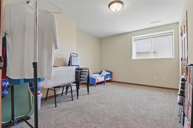 rec room featuring baseboards, visible vents, and carpet floors