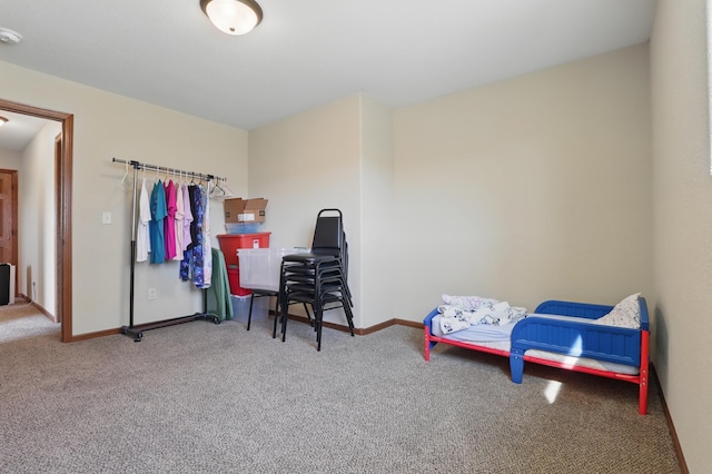 bedroom featuring carpet floors and baseboards