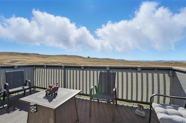 wooden terrace with a patio