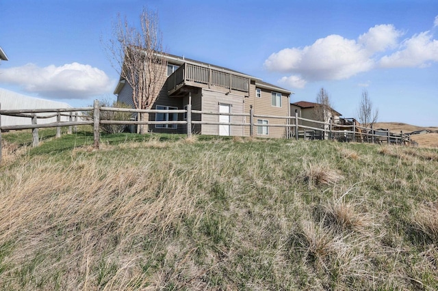 rear view of house with fence