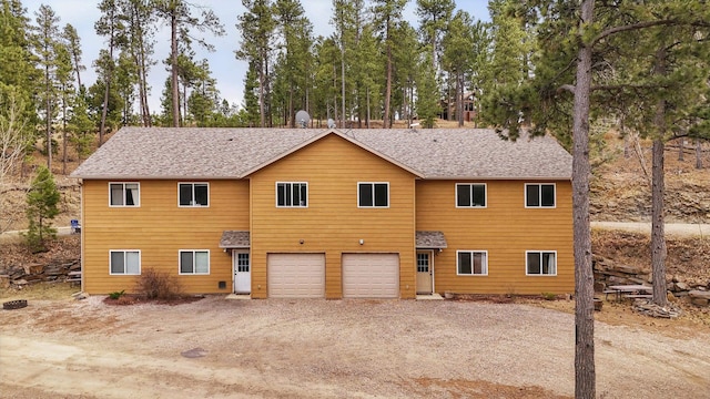 12634 Robins Roost Rd, Hill City, SD 57745 - view of front of property with an attached garage and dirt driveway