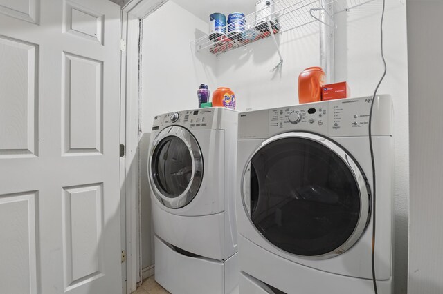 12634 Robins Roost Rd, Hill City, SD 57745 - laundry room featuring separate washer and dryer, laundry area, and light tile patterned flooring