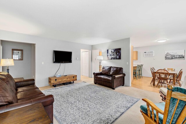 12634 Robins Roost Rd, Hill City, SD 57745 - living area featuring light carpet and a wall unit AC