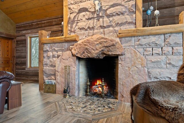 20097 Higgins Gulch Rd, Spearfish, SD 57783 - details with wood ceiling, a warm lit fireplace, and wood finished floors