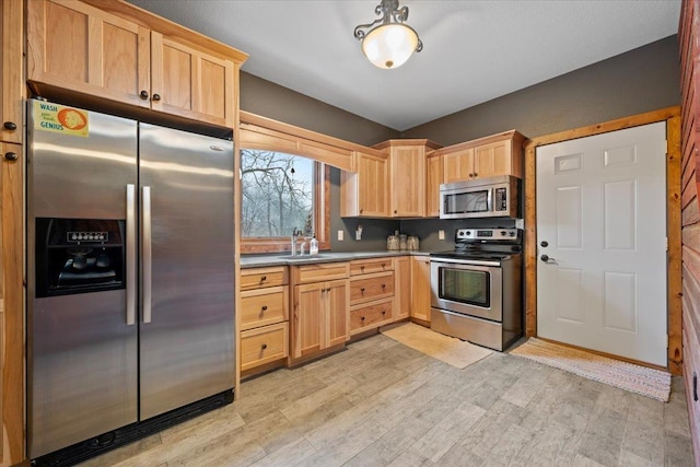 20097 Higgins Gulch Rd, Spearfish, SD 57783 - kitchen featuring a sink, appliances with stainless steel finishes, light brown cabinets, and light wood finished floors