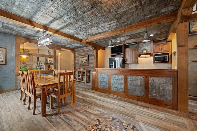 20097 Higgins Gulch Rd, Spearfish, SD 57783 - dining room with wood finished floors and beam ceiling