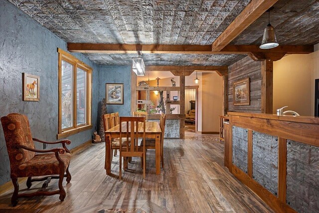 20097 Higgins Gulch Rd, Spearfish, SD 57783 - dining area with beam ceiling and hardwood / wood-style floors