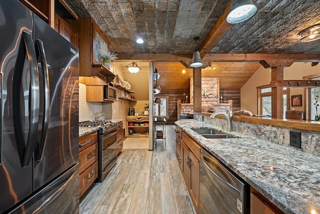 20097 Higgins Gulch Rd, Spearfish, SD 57783 - kitchen with light wood-type flooring, a sink, brown cabinets, and black appliances