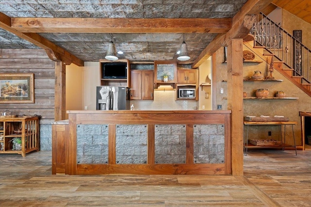 20097 Higgins Gulch Rd, Spearfish, SD 57783 - kitchen with appliances with stainless steel finishes, decorative backsplash, open shelves, and wood finished floors