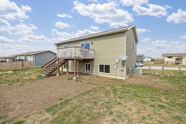 back of house with a wooden deck, cooling unit, stairway, and fence