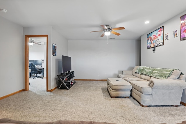 carpeted living room featuring baseboards, a ceiling fan, and recessed lighting