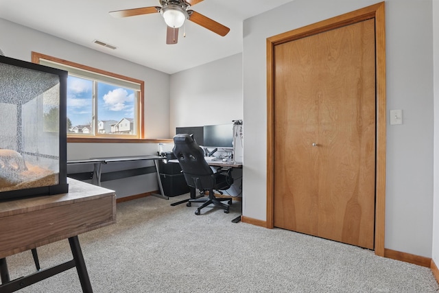 office with baseboards, a ceiling fan, carpet flooring, and visible vents