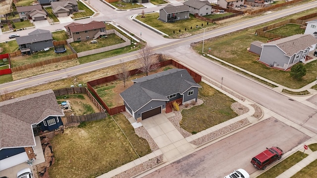 birds eye view of property with a residential view