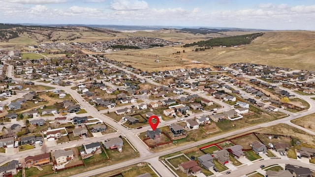 birds eye view of property with a residential view