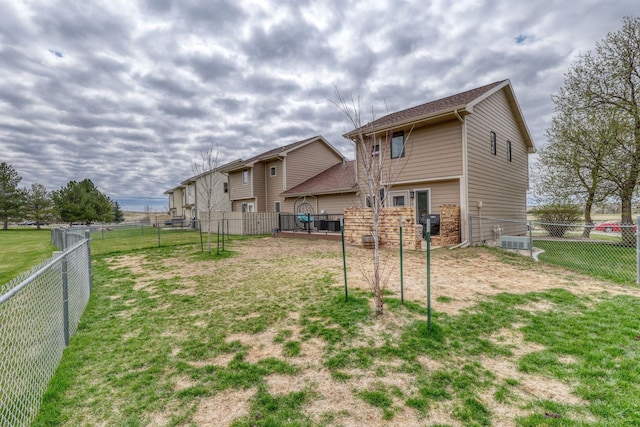 view of yard with a fenced backyard and cooling unit