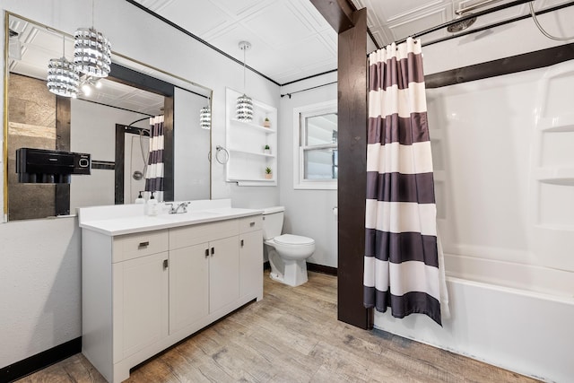 bathroom with shower / bath combination with curtain, wood finished floors, toilet, vanity, and baseboards