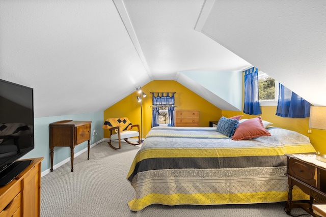 carpeted bedroom featuring vaulted ceiling and baseboards