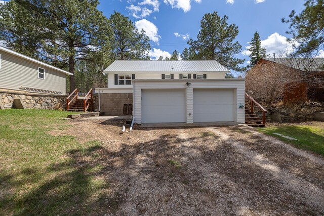 garage featuring driveway