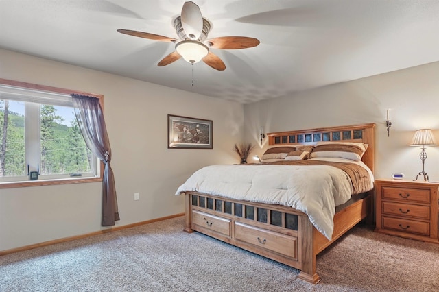 12388 Little Tiger Ln, Hill City, SD 57745 - bedroom with carpet flooring, baseboards, and ceiling fan