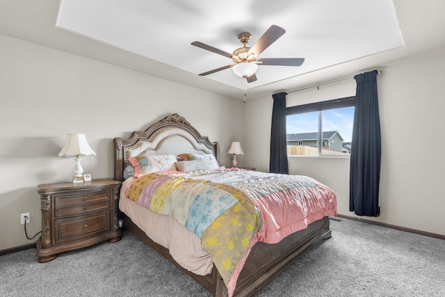 carpeted bedroom featuring a ceiling fan and baseboards