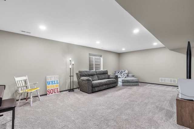 living room featuring baseboards, visible vents, carpet floors, and recessed lighting