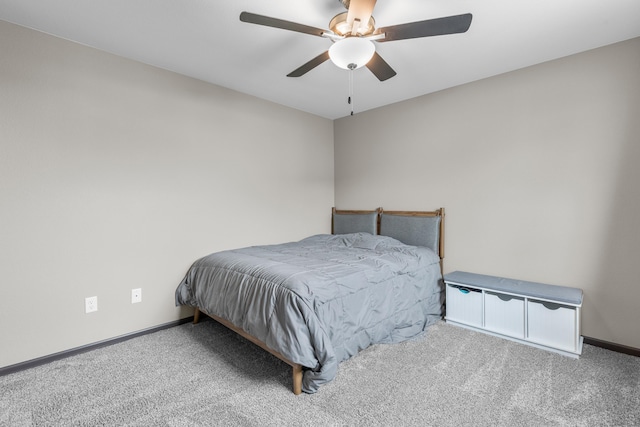 bedroom with ceiling fan, baseboards, and carpet