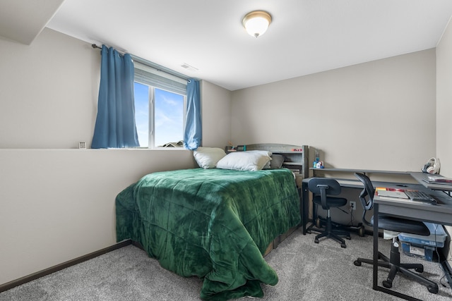 carpeted bedroom with baseboards and visible vents