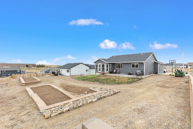 ranch-style house with fence