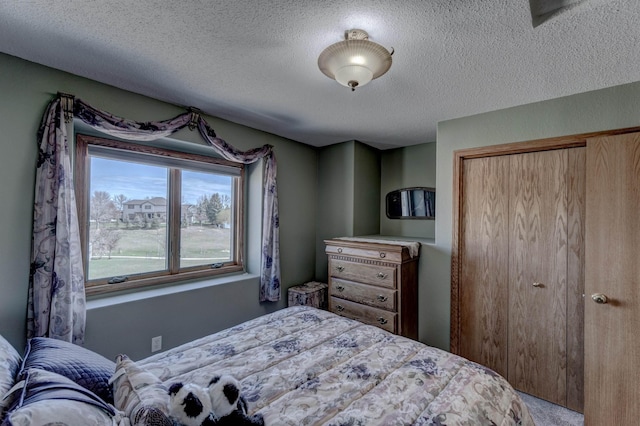 5341 Scrub Oak Cir, Rapid City, SD 57702 - bedroom with carpet flooring, a textured ceiling, and a closet