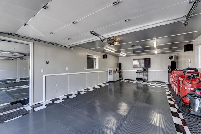 5341 Scrub Oak Cir, Rapid City, SD 57702 - garage featuring a wainscoted wall and a garage door opener