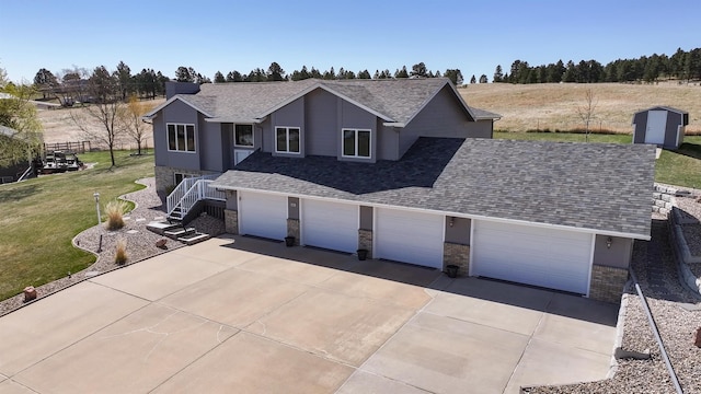 5341 Scrub Oak Cir, Rapid City, SD 57702 - view of front of property featuring a garage, a front lawn, roof with shingles, and concrete driveway
