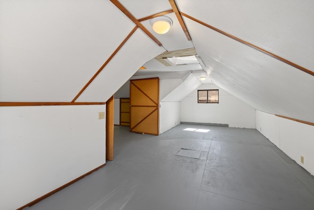 bonus room featuring lofted ceiling