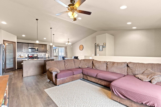 living room with recessed lighting, wood finished floors, ceiling fan, and vaulted ceiling